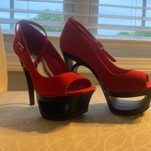Red suede and black platform high heels